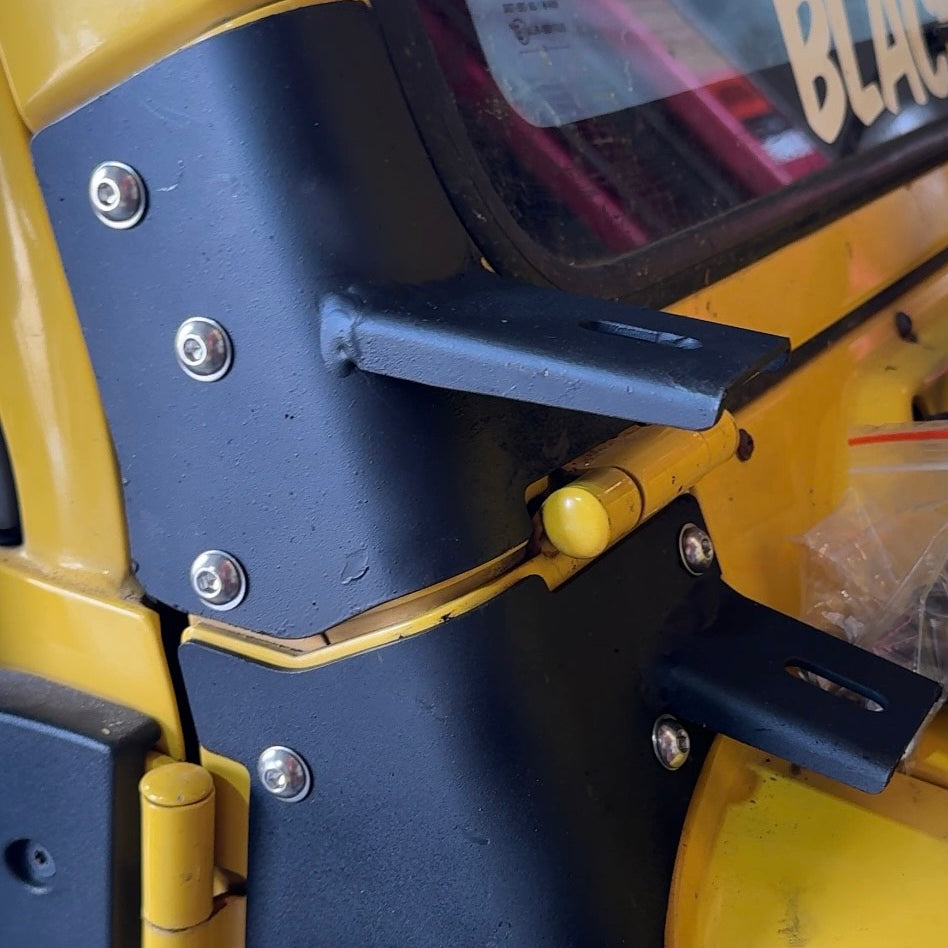 Jeep TJ Wrangler A-pillar light bracket mounting detail showing bolt-on fitment and hinge mounting position