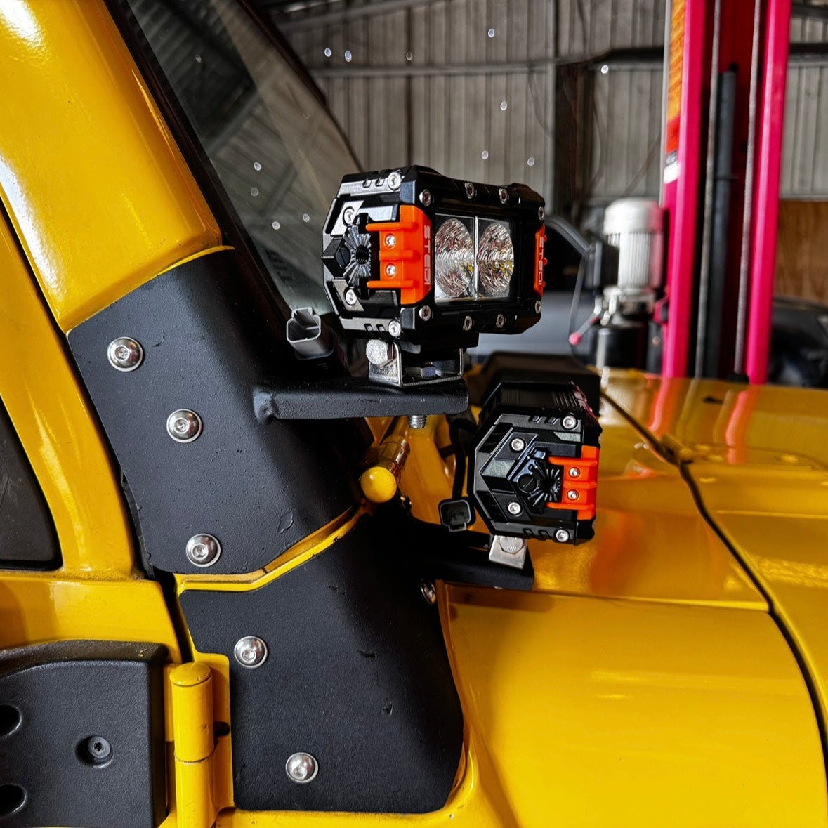Jeep TJ Wrangler ditch light brackets mounted showing bonnet clearance and low profile positioning with LED lights installed