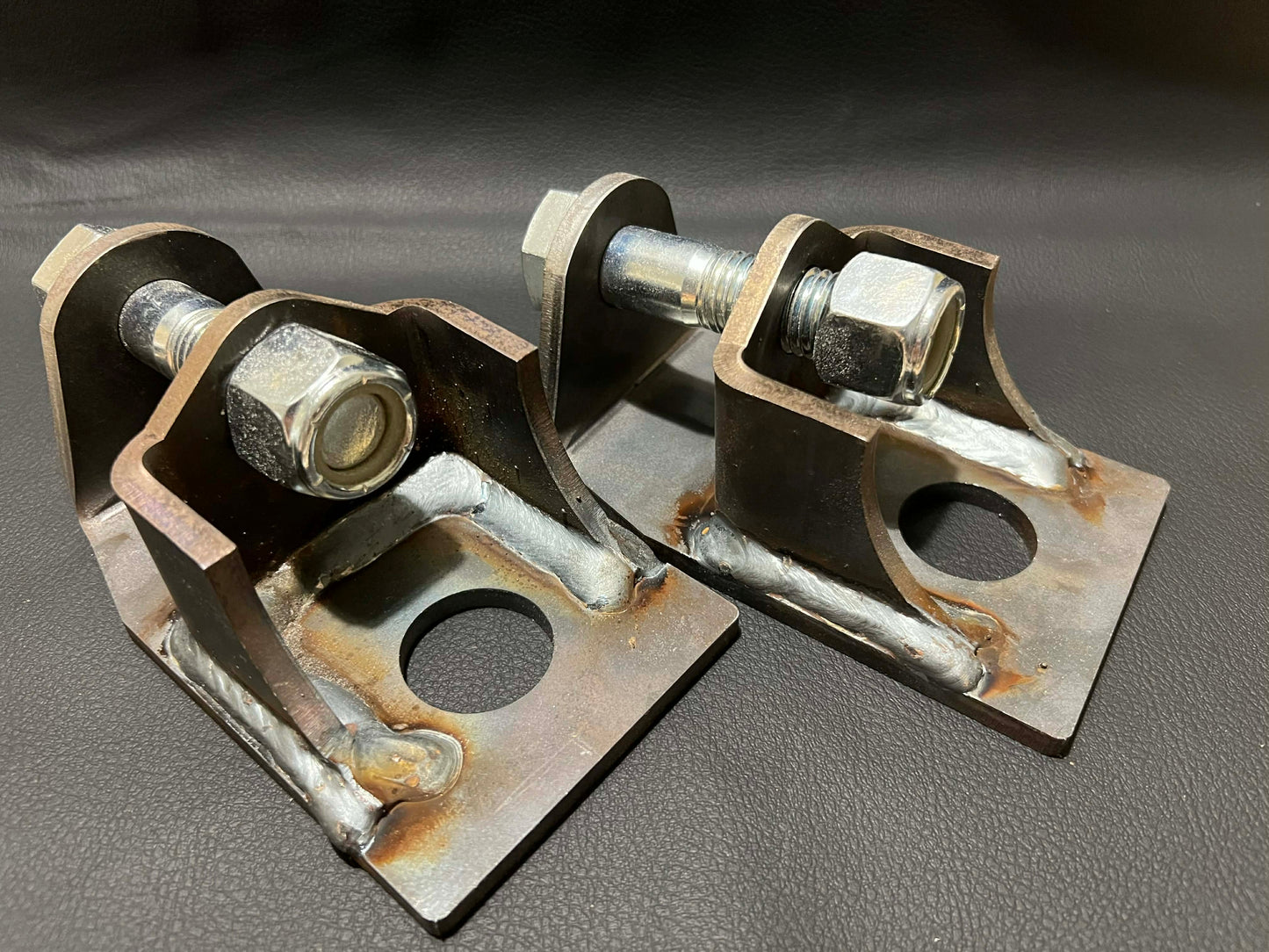 Rear lower shock mounts for Nissan Patrol GQ GU showing raised heavy duty design