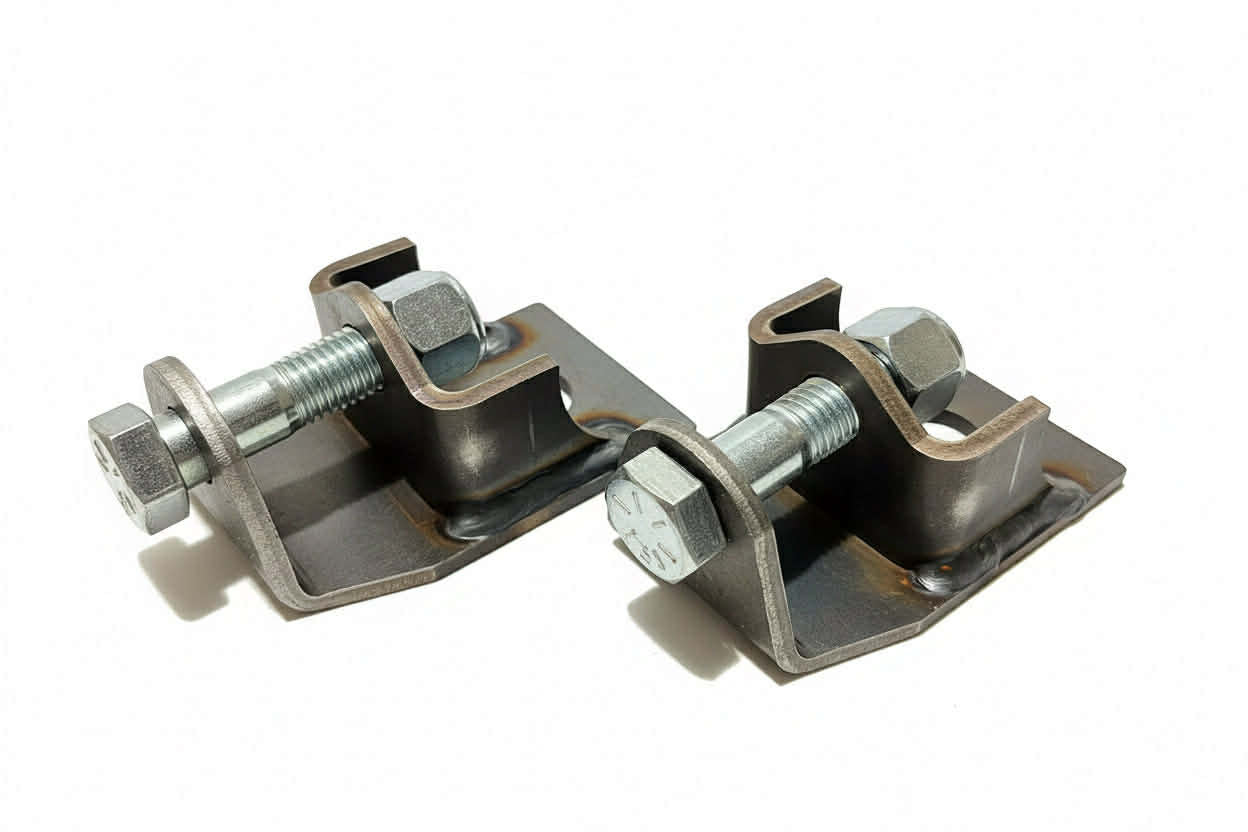 Comparison showing improved clearance of raised rear shock mounts on Nissan Patrol